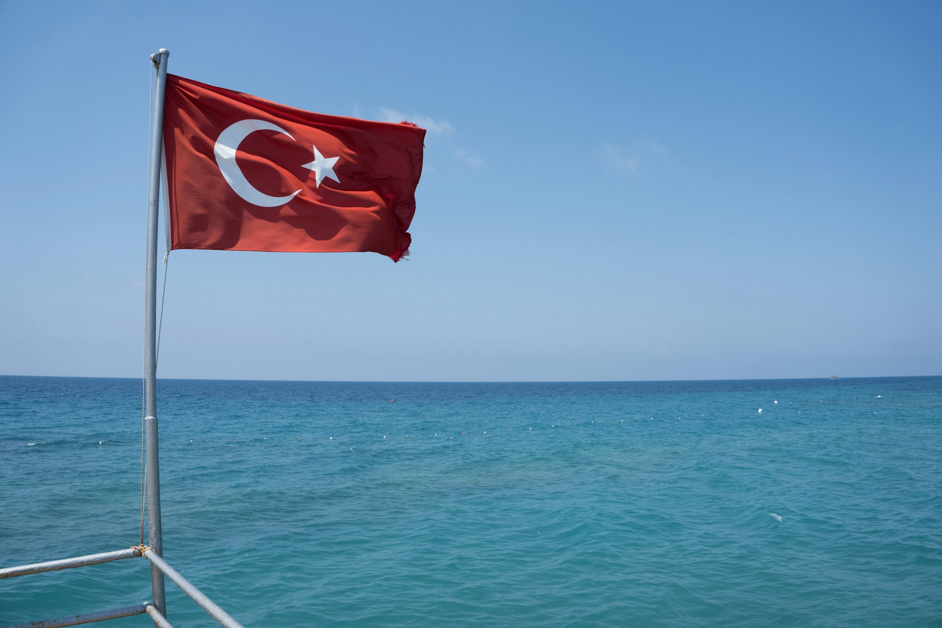 A flag on a boat in the water
